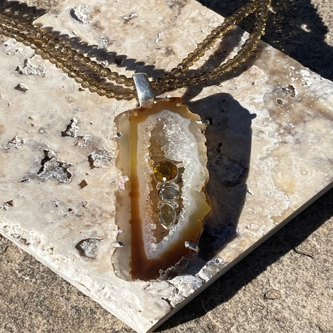 Amber colored Geode with Citrine on Brown Crystal strand